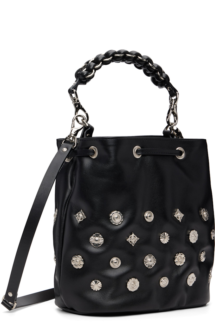 Buffed leather shoulder bag.

· Graphic hardware throughout
· Detachable braided carry handle
· Detachable crossbody strap
· Drawstring closure
· Patch pocket at interior
· Faille lining
· H9" x W9" x D5"

Part of the TOGA TOO collection.

Supplier color: Black