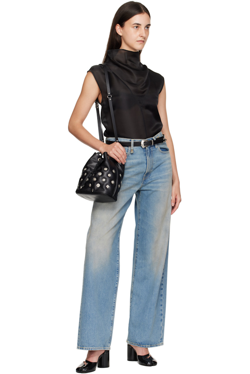 Buffed leather shoulder bag.

· Graphic hardware throughout
· Detachable braided carry handle
· Detachable crossbody strap
· Drawstring closure
· Patch pocket at interior
· Faille lining
· H9" x W9" x D5"

Part of the TOGA TOO collection.

Supplier color: Black