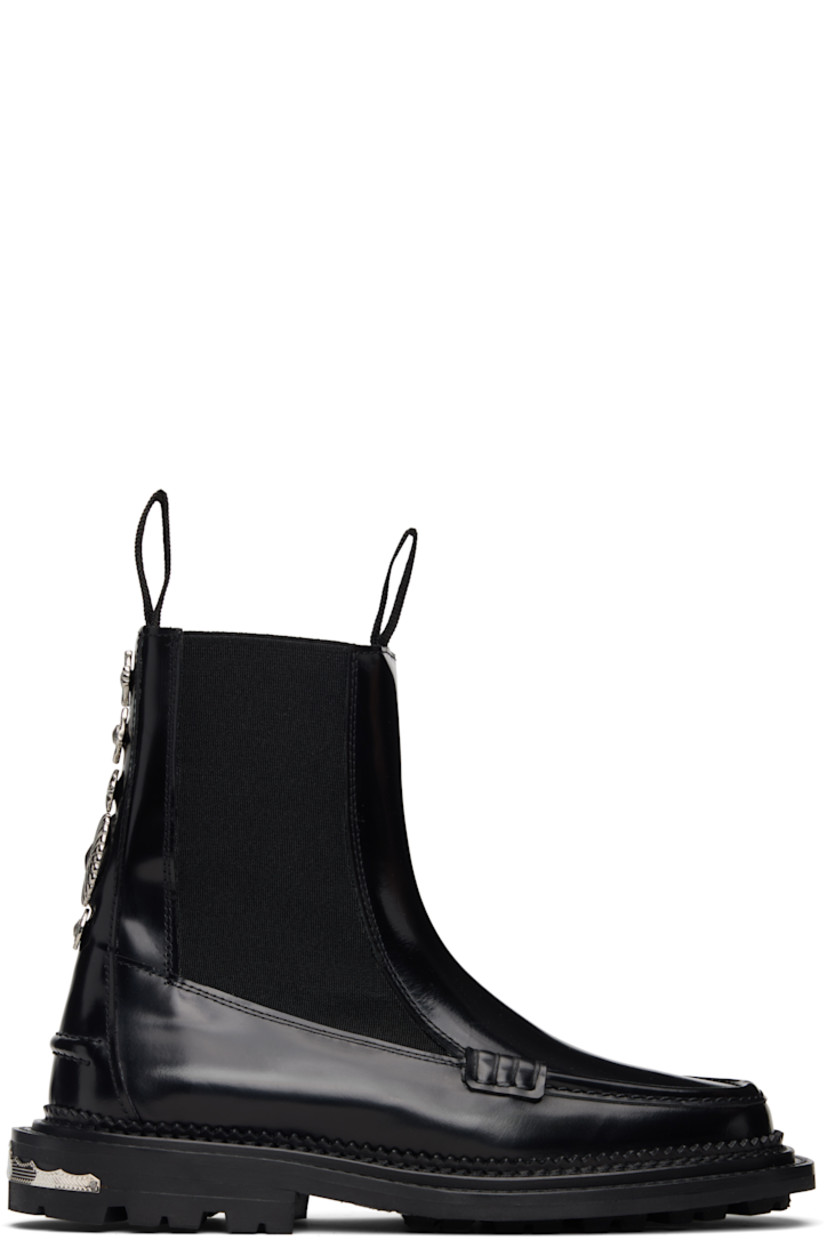 Ankle-high polished leather Chelsea boots.

· Square moc toe
· Pull-loops at collar
· Elasticized gusset at sides
· Graphic hardware at heel tab
· Buffed leather lining
· Serrated edge and topstitching at welt
· Engraved plaque at heel
· Treaded rubber sole

Supplier color: Black