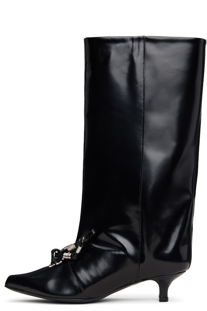 Knee-high polished leather boots.

· Pointed toe
· Knotted straps with O-rings at vamp
· Buffed leather lining
· Covered kitten heel with rubber injection
· Leather sole
· Heel: H1.5"

Supplier color: Black