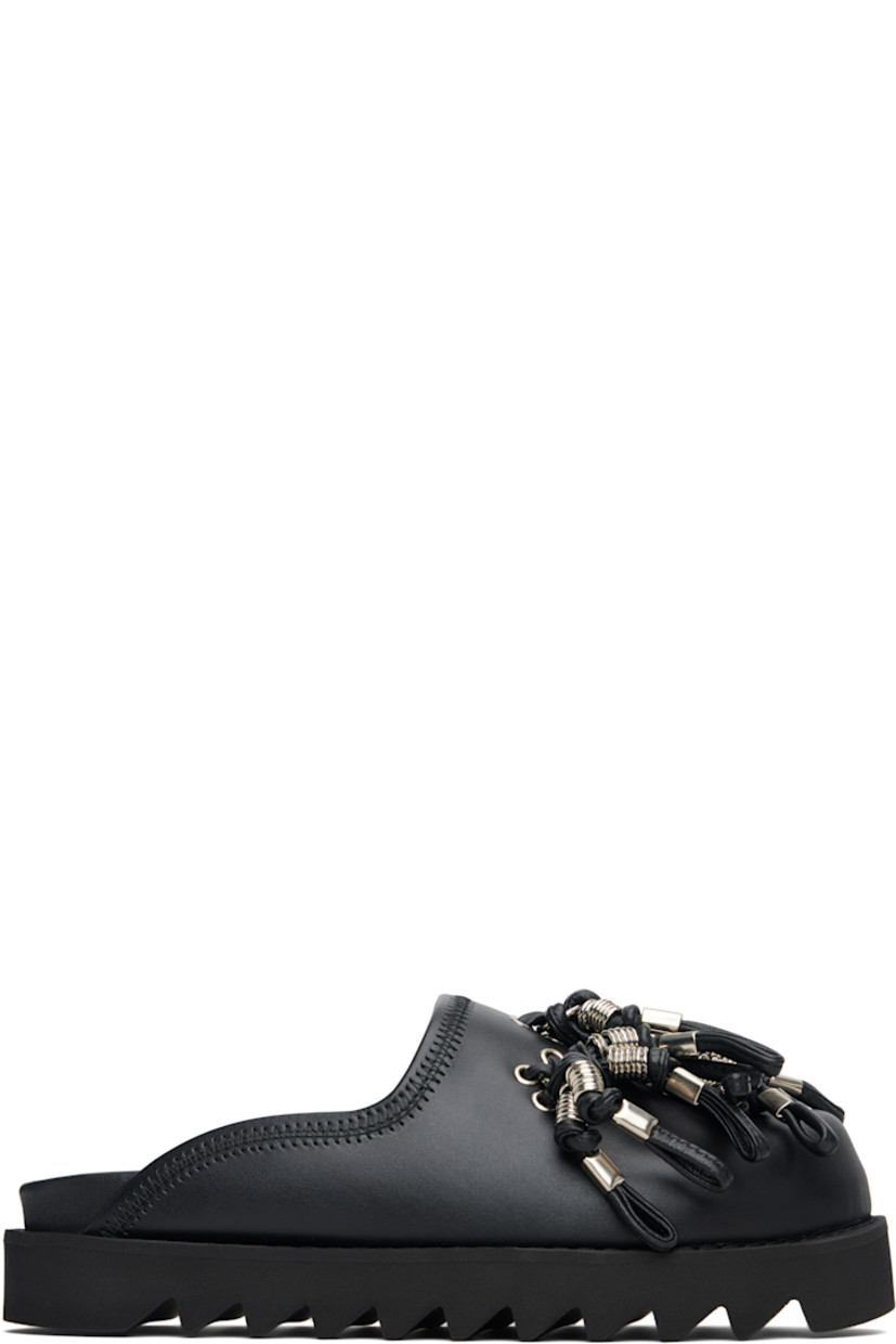 Buffed leather slip-on loafers.

· Grommets and tassels at vamp 
· Logo stamp at molded footbed
· Treaded rubber sole 
· Platform: H1.5"

Supplier color: Black