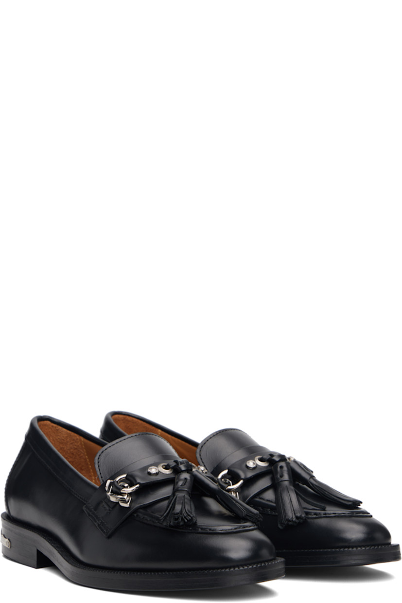 Polished leather loafers.

· Moc toe
· Tassels and strap with graphic hardware at vamp
· Serrated detailing at welt
· Plaque at heel
· Stacked leather heel with rubber injection
· Leather sole

Supplier color: Black