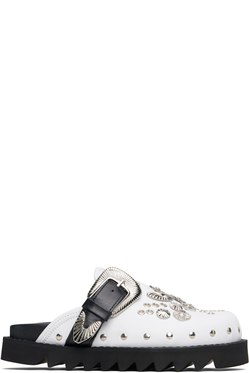 Buffed leather slip-on loafers.

· Pin-buckle strap, grommets, and graphic hardware at vamp
· Rivets at welt 
· Logo stamp at molded footbed
· Treaded foam rubber sole 
· Platform: H1.5"

Available exclusively at SSENSE.

Supplier color: White/Black