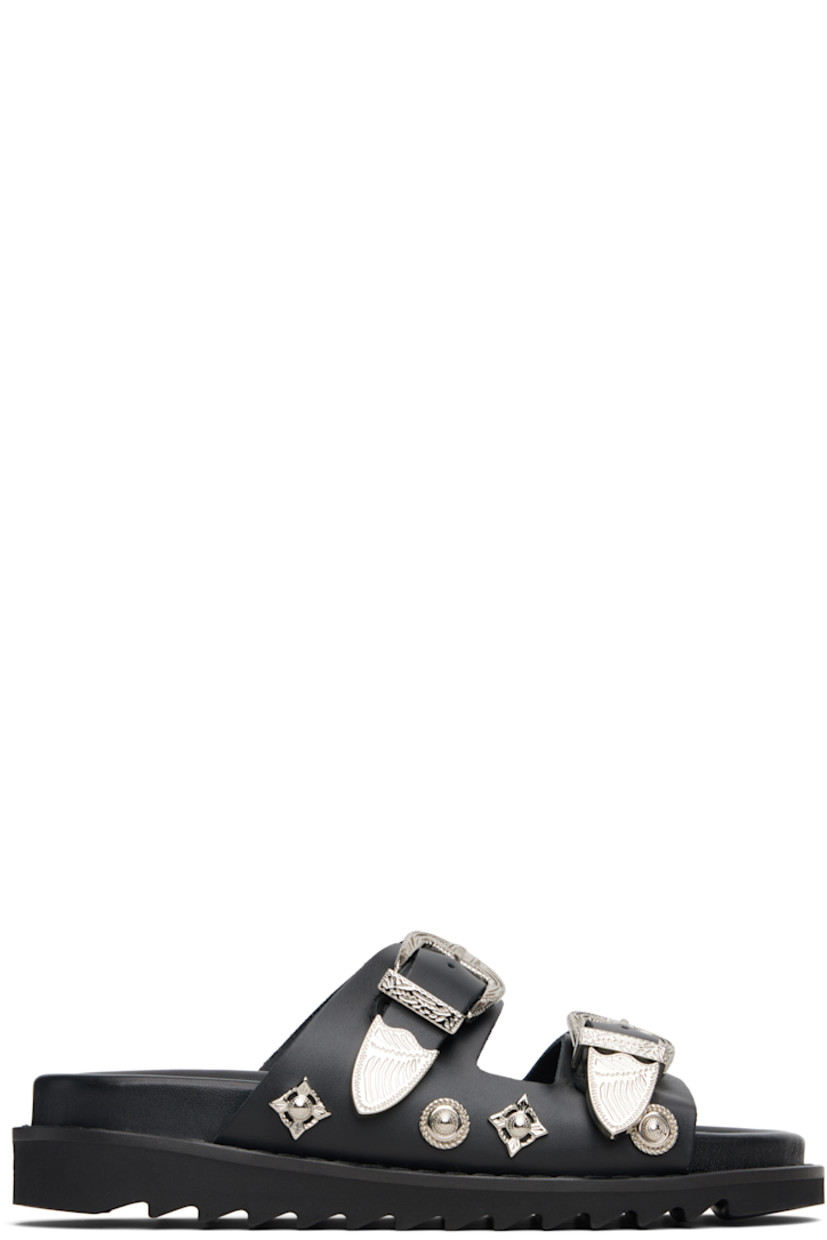 Buffed leather flats sandals.

· Graphic hardware throughout
· Open toe
· Pin-buckle straps at vamp
· Logo stamp at molded footbed
· Treaded rubber sole

Available exclusively at SSENSE.

Supplier color: Black