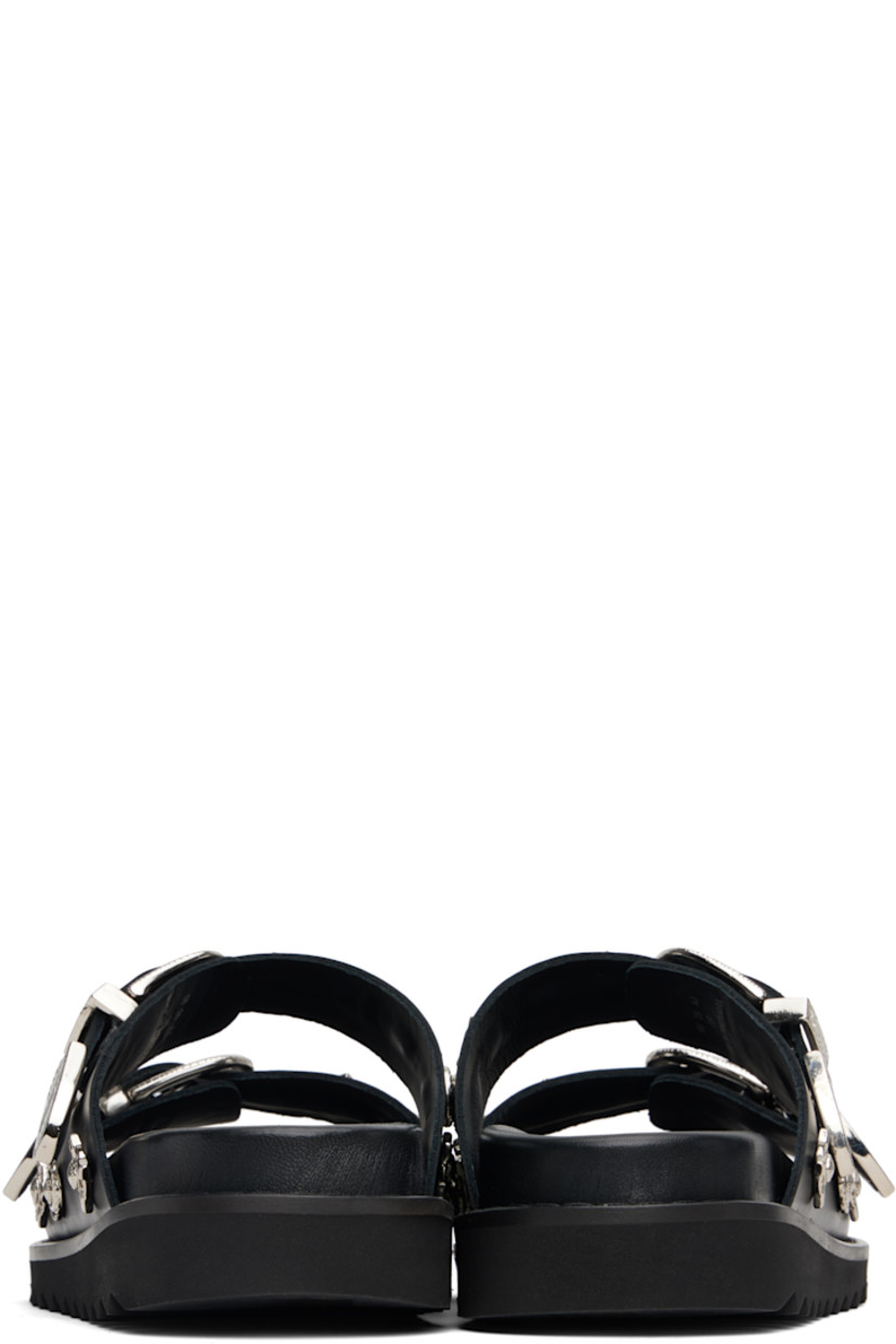 Buffed leather flats sandals.

· Graphic hardware throughout
· Open toe
· Pin-buckle straps at vamp
· Logo stamp at molded footbed
· Treaded rubber sole

Available exclusively at SSENSE.

Supplier color: Black