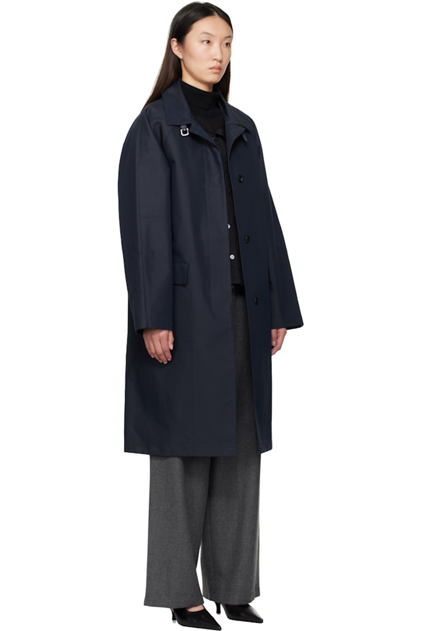 Cotton canvas trench coat.

· Leather pin-buckle tab at spread collar 
· Button closure
· Flap pockets
· Raglan sleeves
· Full check-printed twill lining

Supplier color: Navy