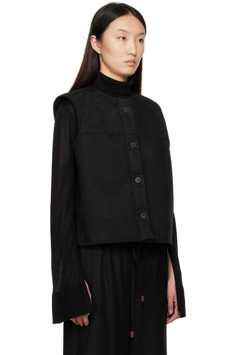 Reversible faux-suede vest.

Reverse in black faux-shearling.

· Round neck
· Button closure
· Seam pockets

Supplier color: Black