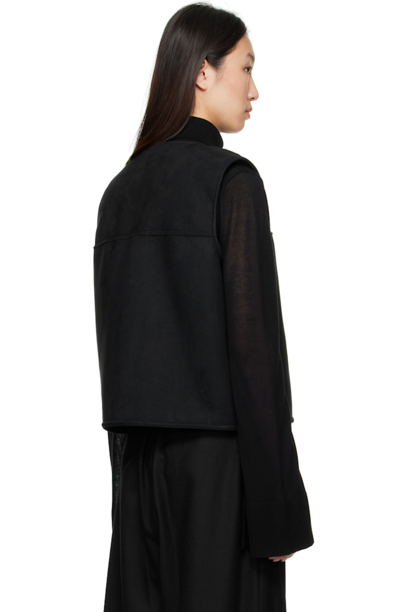 Reversible faux-suede vest.

Reverse in black faux-shearling.

· Round neck
· Button closure
· Seam pockets

Supplier color: Black