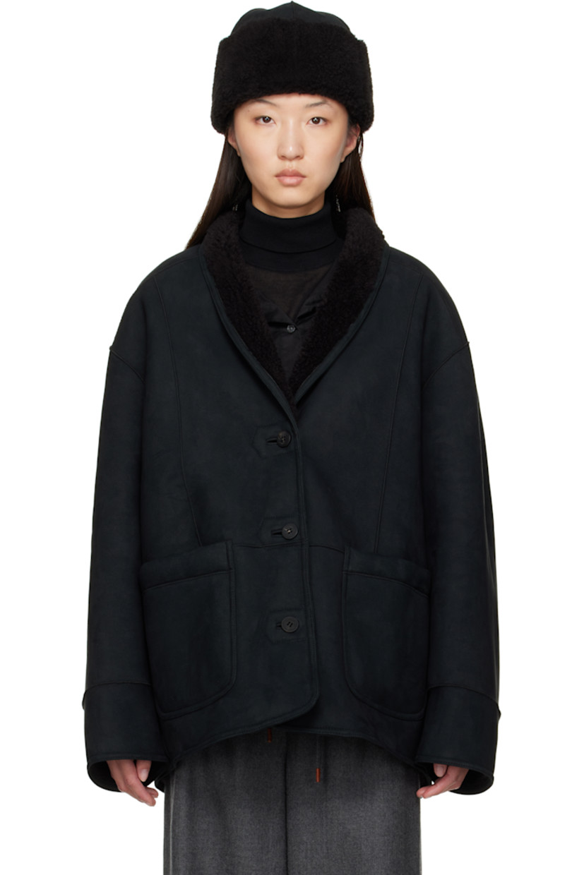 Reversible faux-suede jacket. 

Reverse in black faux-shearling. 

· Shawl collar
· Button closure
· Patch pockets 
· Dropped shoulders

Supplier color: Black