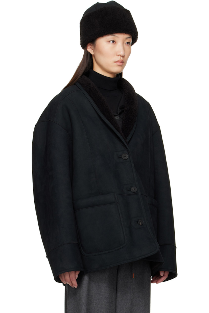 Reversible faux-suede jacket. 

Reverse in black faux-shearling. 

· Shawl collar
· Button closure
· Patch pockets 
· Dropped shoulders

Supplier color: Black
