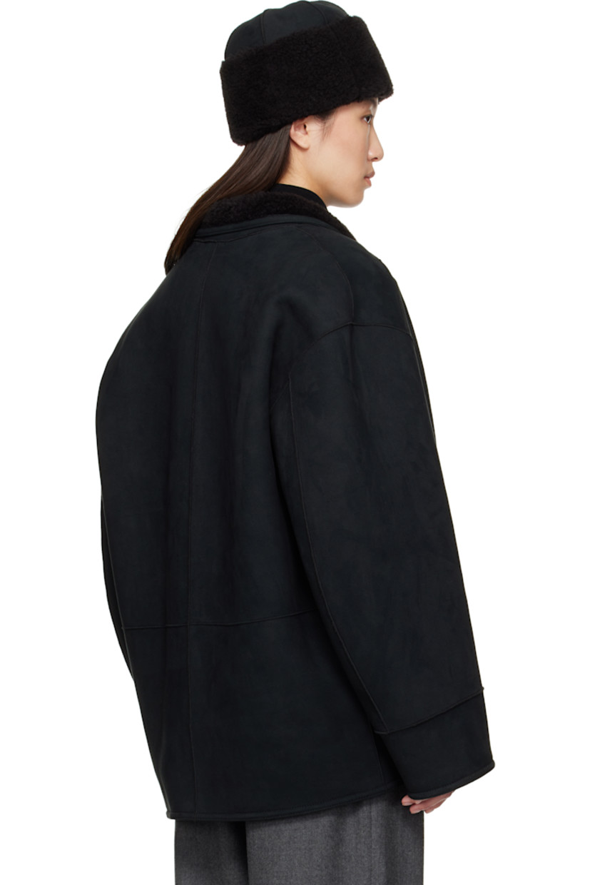 Reversible faux-suede jacket. 

Reverse in black faux-shearling. 

· Shawl collar
· Button closure
· Patch pockets 
· Dropped shoulders

Supplier color: Black