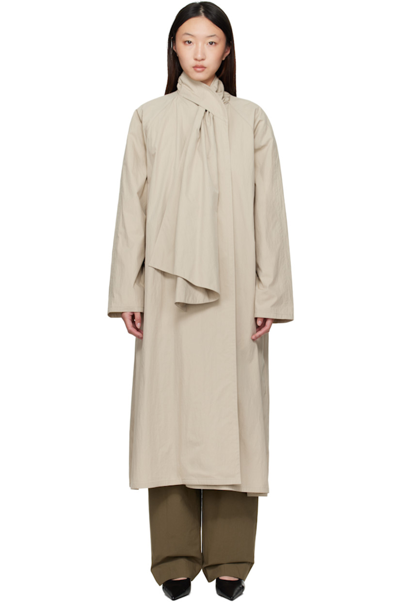 Cotton- and nylon-blend canvas trench coat. 

· Integrated self-tie scarf at shawl collar 
· Button fastening at collar 
· Open front 
· Welt pockets 
· Raglan sleeves 
· Unlined

Supplier color: Beige
