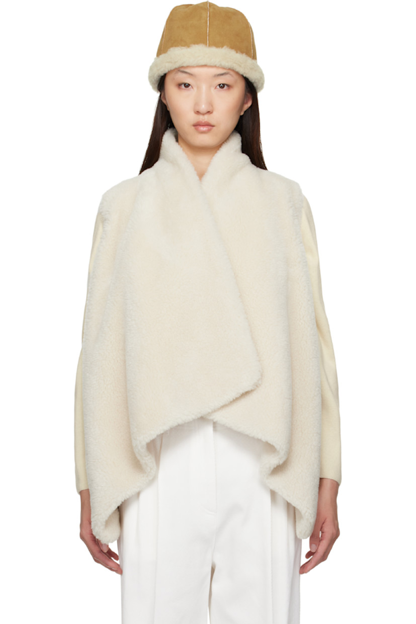 Faux-shearling vest. 

· Shawl collar
· Detachable self-tie belt at waist
· Microfibre lining

Supplier color: Ivory