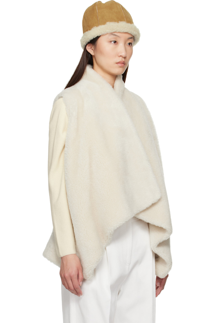 Faux-shearling vest. 

· Shawl collar
· Detachable self-tie belt at waist
· Microfibre lining

Supplier color: Ivory