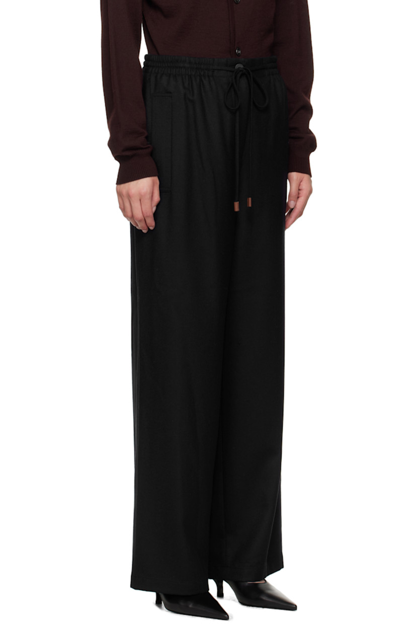 Wool twill trousers.

· Drawstring at elasticized waistband
· Four-pocket styling
· Zip fly

Supplier color: Navy
