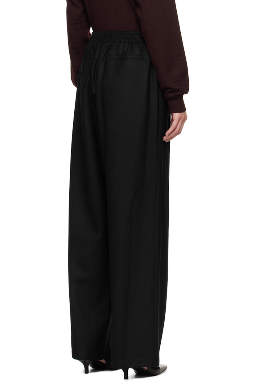 Wool twill trousers.

· Drawstring at elasticized waistband
· Four-pocket styling
· Zip fly

Supplier color: Navy