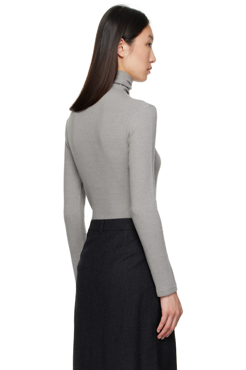 Stretch viscose- and wool-blend ribbed jersey turtleneck. Asymmetric hem.

Supplier color: Gray