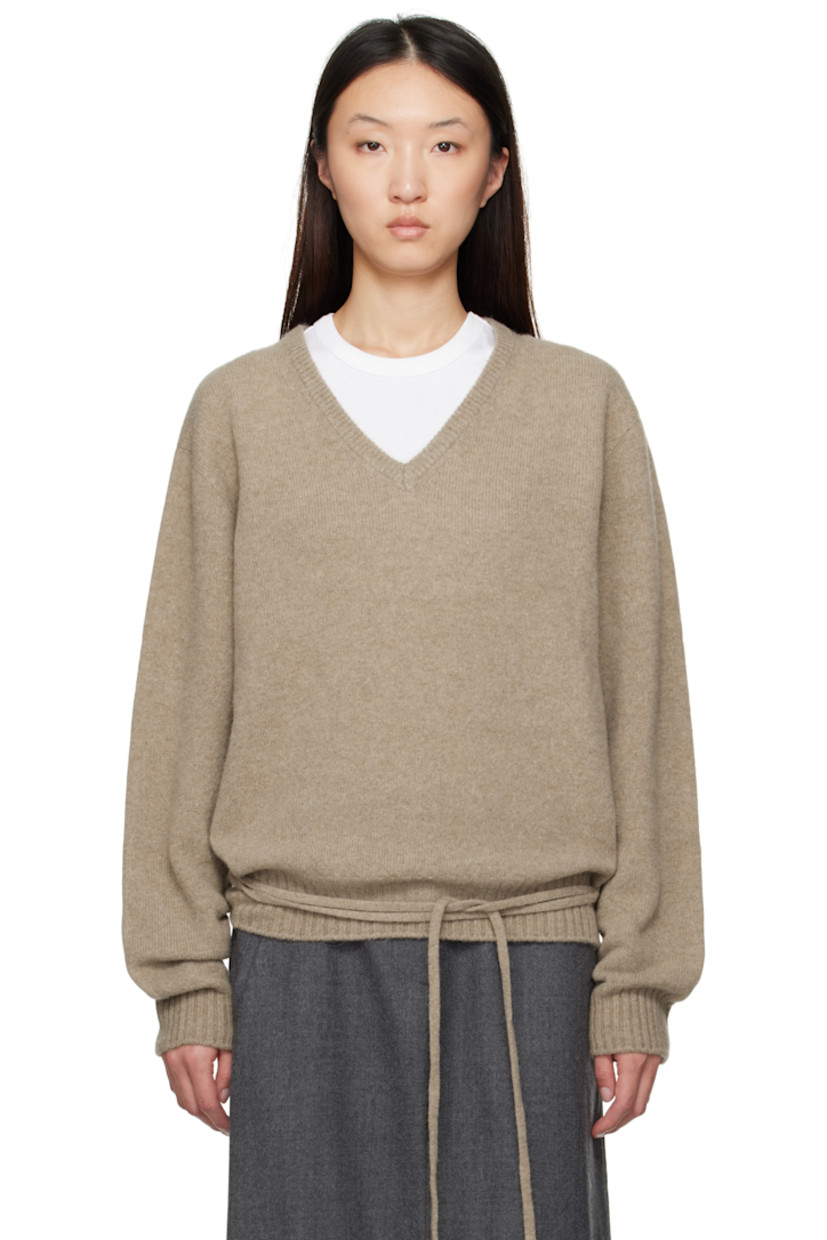 Brushed knit wool- and baby alpaca-blend sweater. 

· Rib-knit V-neck, hem, and cuffs
· Loops and self-tie straps at waist

Supplier color: Beige