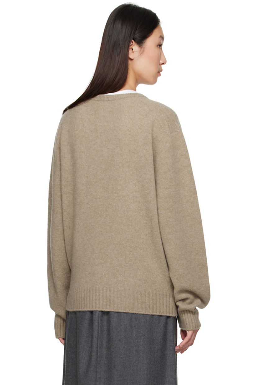 Brushed knit wool- and baby alpaca-blend sweater. 

· Rib-knit V-neck, hem, and cuffs
· Loops and self-tie straps at waist

Supplier color: Beige