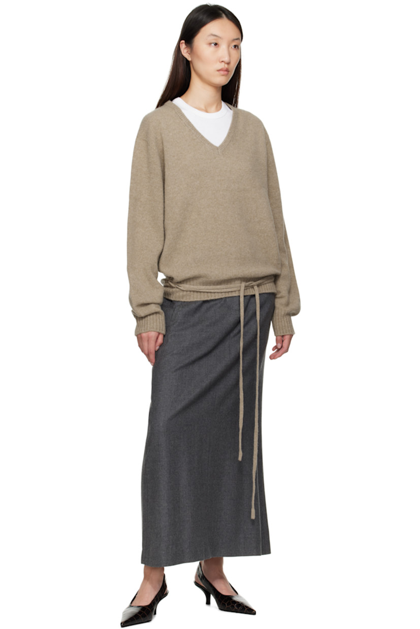 Brushed knit wool- and baby alpaca-blend sweater. 

· Rib-knit V-neck, hem, and cuffs
· Loops and self-tie straps at waist

Supplier color: Beige