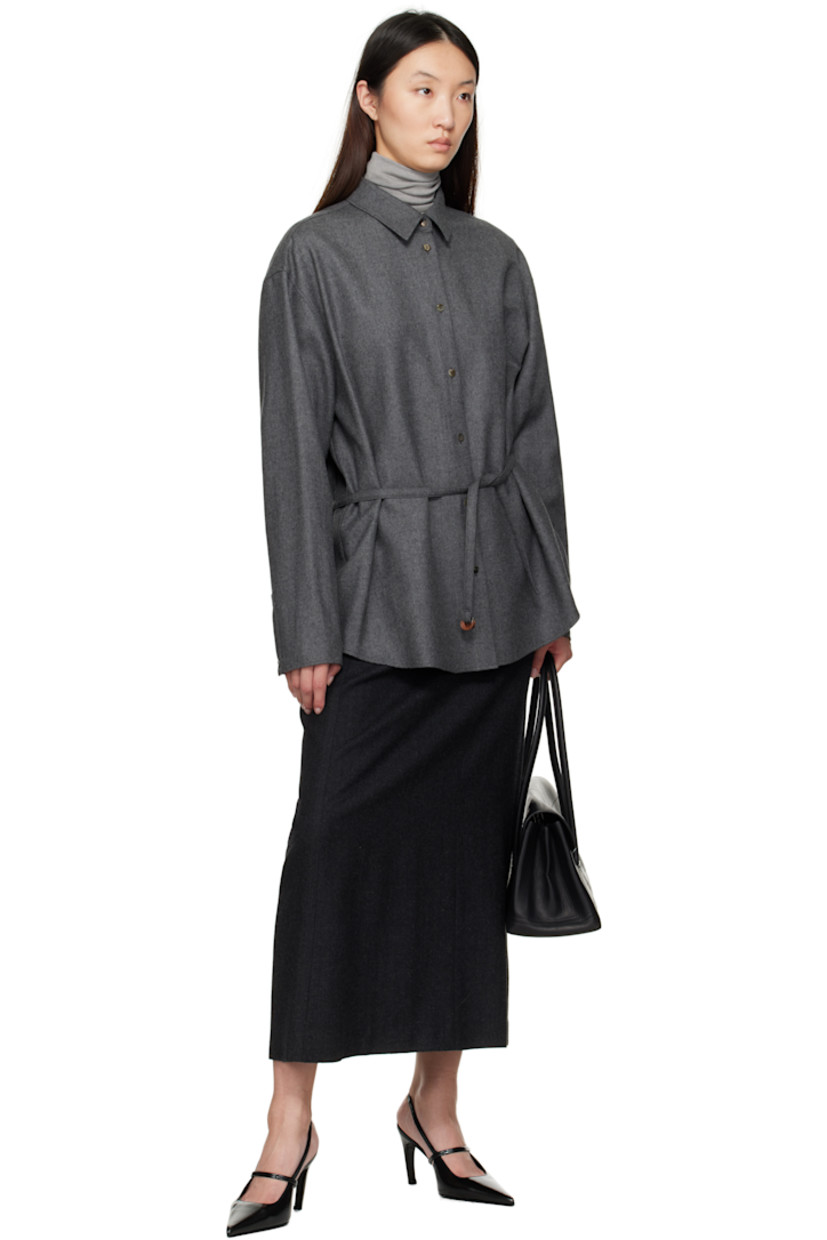 Brushed wool twill shirt. 

· Spread collar
· Button closure
· Belt loops and detachable self-tie belt
· Shirttail hem 
· Dropped shoulders
· Button fastening at cuffs

Supplier color: Gray