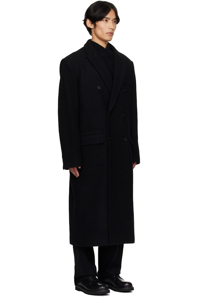 Wool- and cashmere-blend melton coat. 

· Peaked lapel
· Double-breasted button closure
· Welt pocket at chest
· Flap pockets at waist
· Buttoned surgeon's cuffs
· Logo hardware at back collar 
· Central vent at back hem 
· Welt pockets at interior 
· Full satin twill lining 

Supplier color: Black