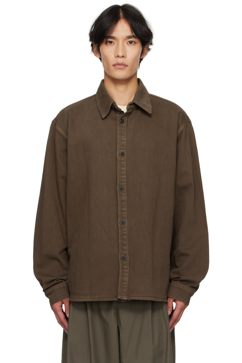 Non-stretch denim shirt.

· Spread collar 
· Button closure
· Shirttail hem 
· Dropped shoulders
· Buttoned barrel cuffs
· Logo hardware at back collar
· Central seam at back
· Contrast stitching in tan 

Supplier color: Brown