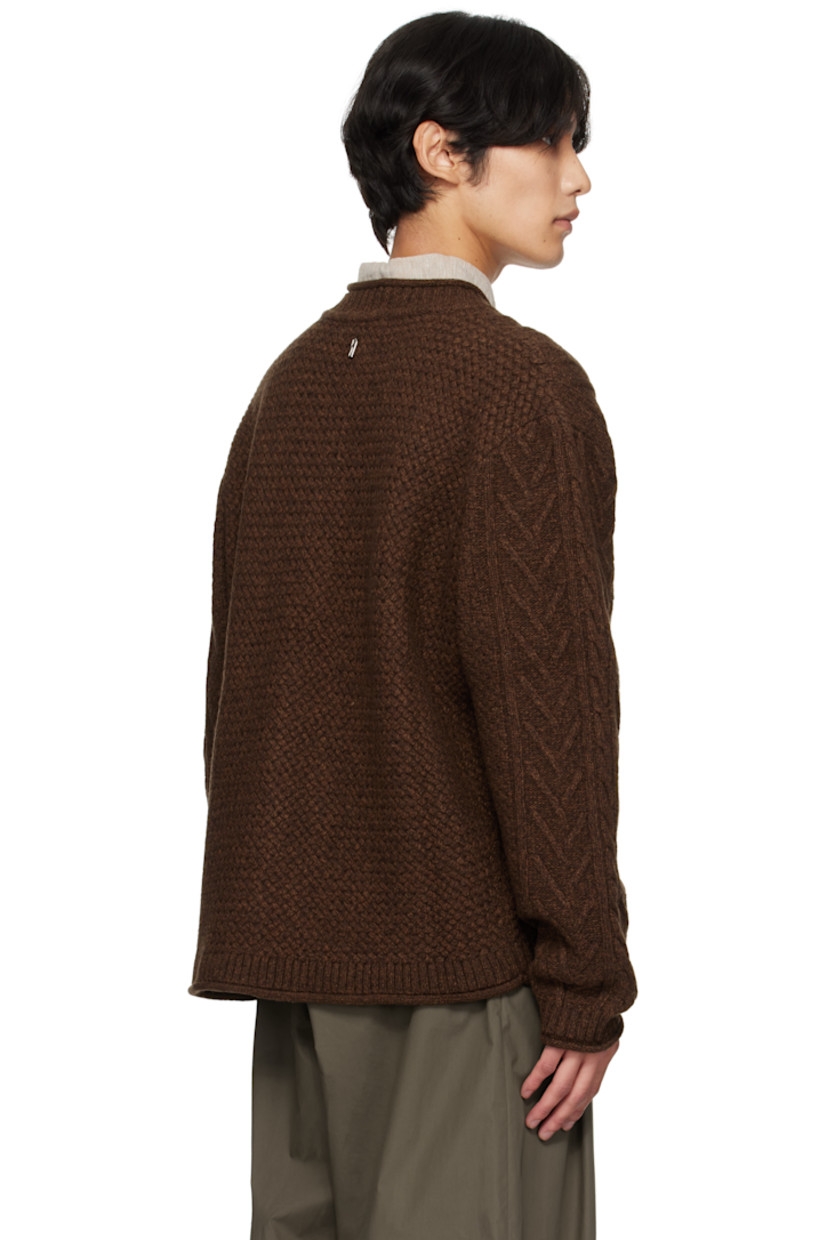 Cable-knit lambswool-blend cardigan. 

· Rolled edges throughout 
· Rib-knit crewneck, hem, and cuffs
· Button closure
· Dropped shoulders
· Logo hardware at back collar

Supplier color: Dark brown