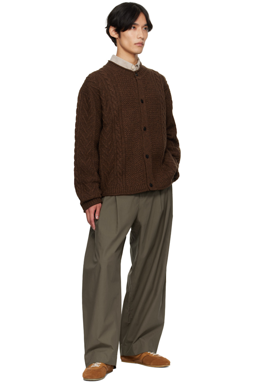 Cable-knit lambswool-blend cardigan. 

· Rolled edges throughout 
· Rib-knit crewneck, hem, and cuffs
· Button closure
· Dropped shoulders
· Logo hardware at back collar

Supplier color: Dark brown