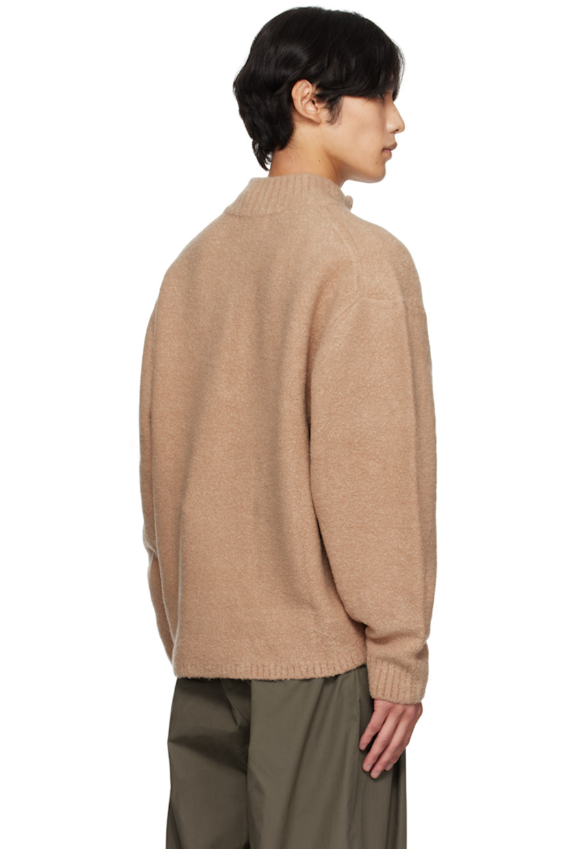 Bouclé-knit stretch wool-blend sweater.

· Rib-knit stand collar, hem, and cuffs
· Half-zip closure
· Dropped shoulders

Supplier color: Camel