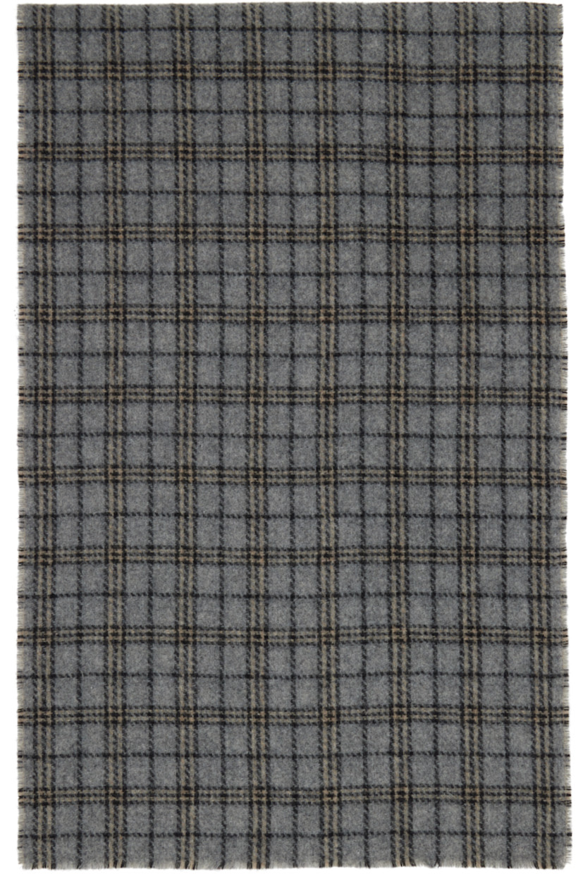Rectangular double-faced knit wool-blend scarf.

· Jacquard check pattern throughout 
· Logo patch at end
· L81" x W15"

Supplier color: Grey double faced check