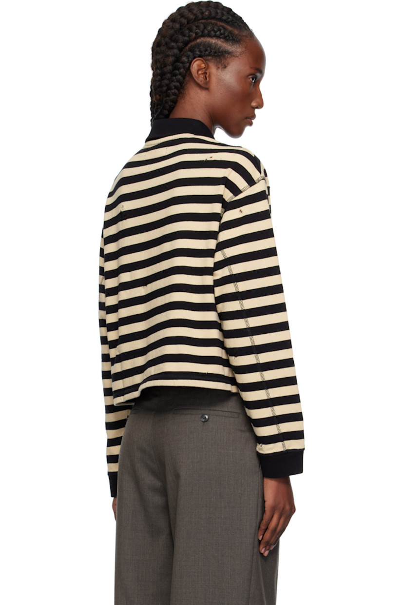 Heavyweight organic cotton jersey polo.

· Stripes and distressing throughout
· Rib-knit spread collar and cuffs
· Three-button placket
· Logo patch at front
· Dropped shoulders

Supplier color: Wide black stripe