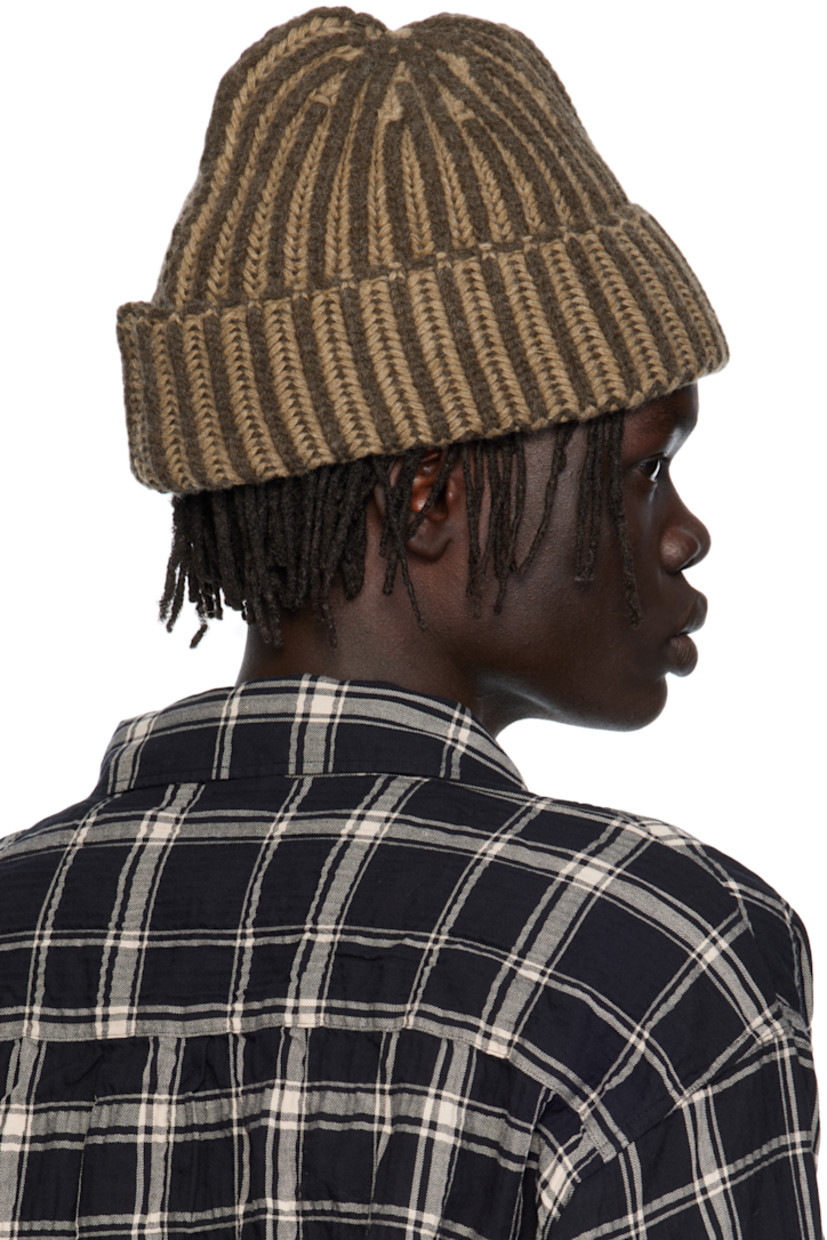 Knit wool beanie.

· Knit stripes throughout
· Rolled brim

Supplier color: Biscuit