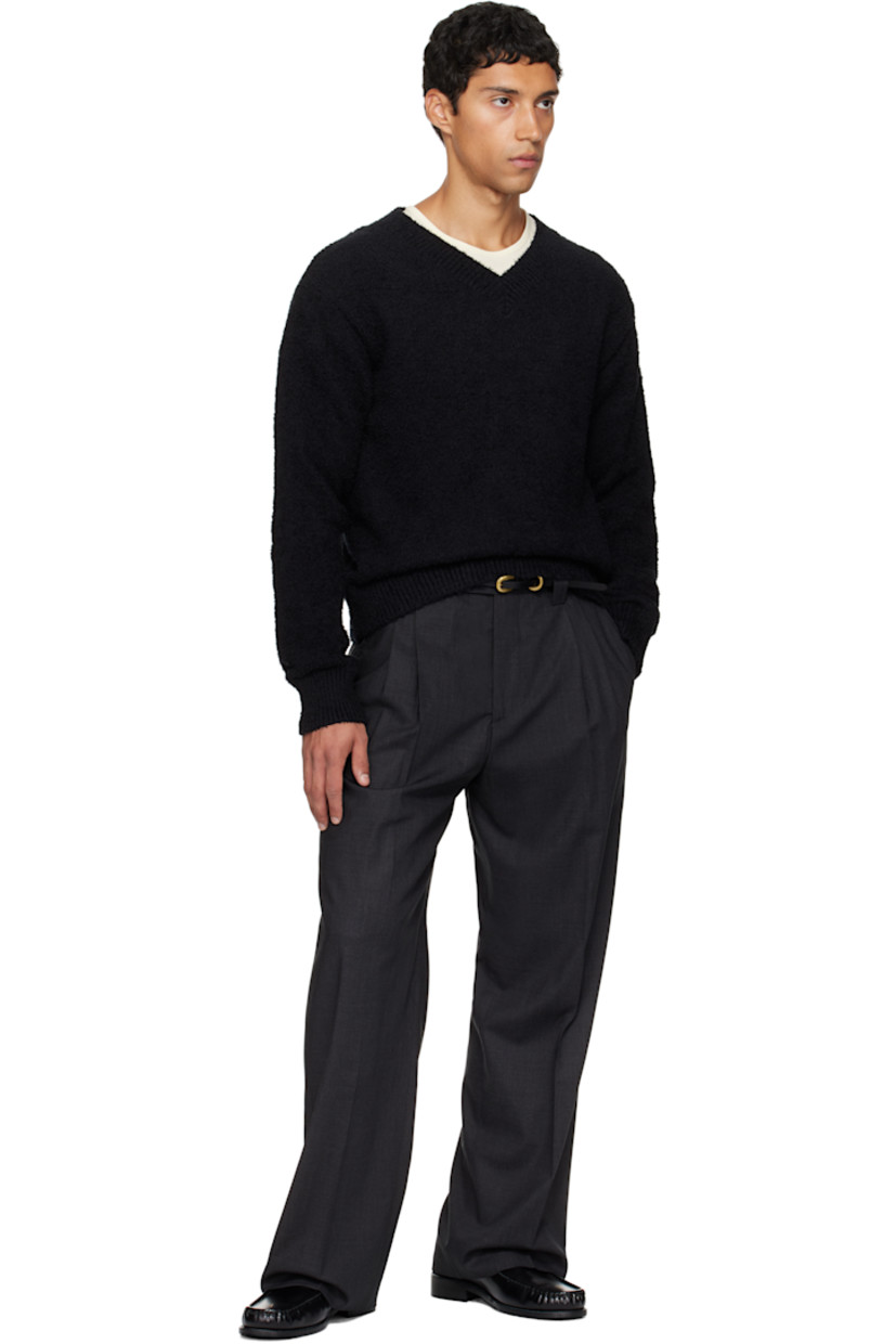 Deadstock wool delaine trousers.

· Wide straight-leg
· Mid-rise
· Belt loops
· Four-pocket styling
· Zip fly
· Pleats at front
· Creased legs
· Partial satin lining

Supplier color: Dark grey wool