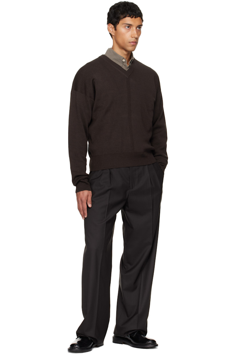 Deadstock wool twill trousers.

· Wide straight-leg
· Mid-rise
· Belt loops
· Four-pocket styling
· Zip fly
· Pleats at front
· Creased legs
· Partial satin lining

Supplier color: Coffee twill wool