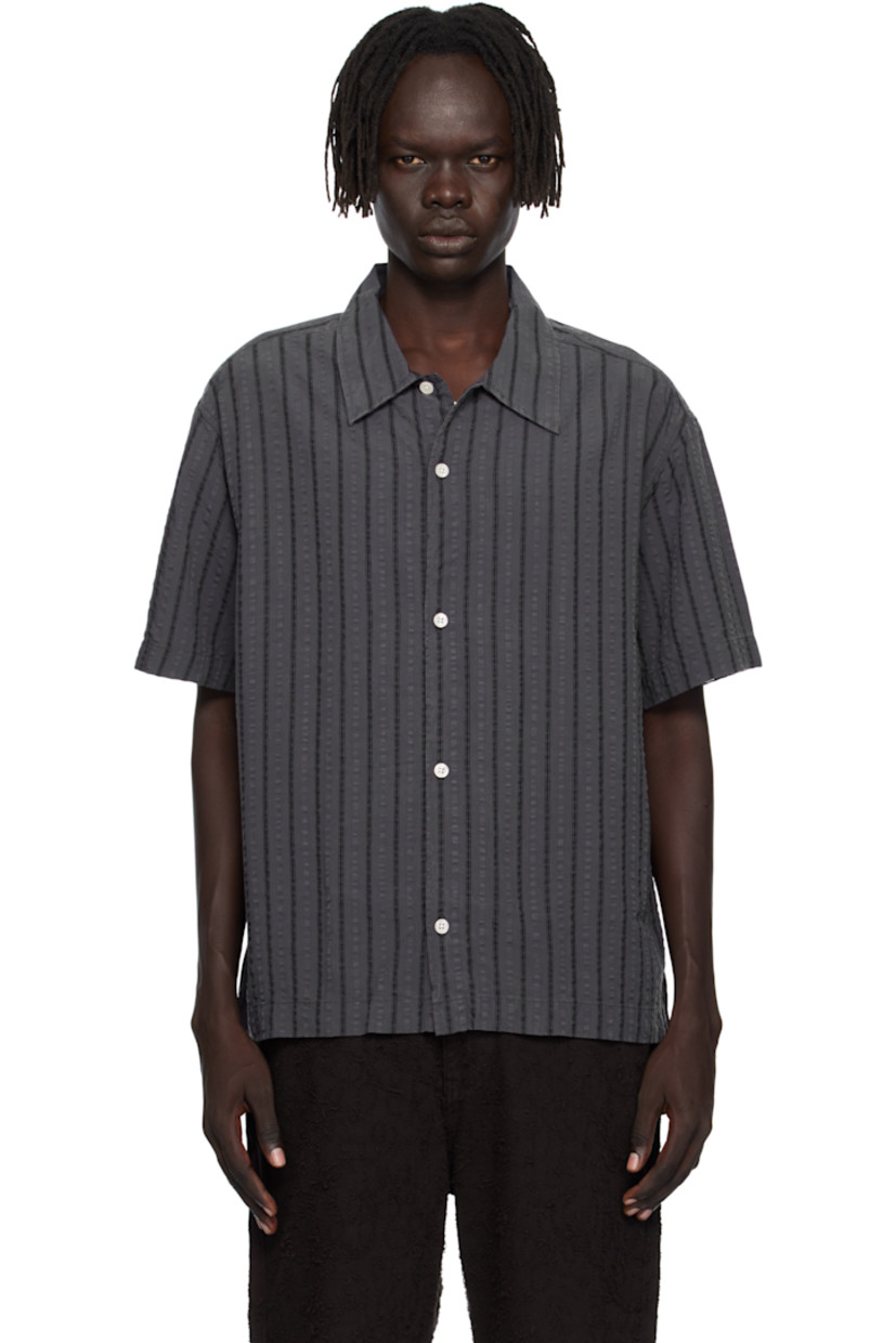 Tencel seersucker shirt.

· Stripes throughout
· Spread collar
· Button closure
· Box pleat at back yoke

Available exclusively at SSENSE.

Supplier color: Dark grey stripe