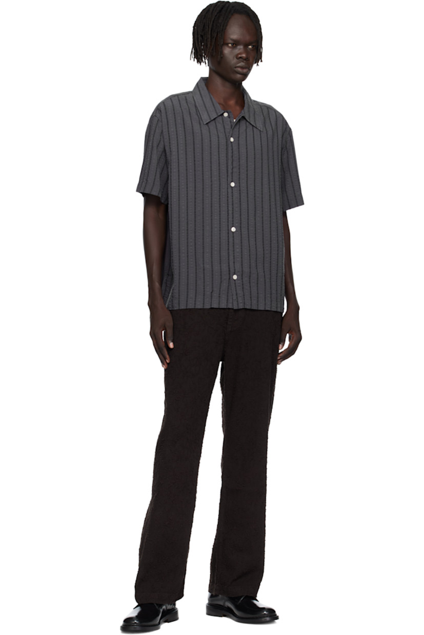 Tencel seersucker shirt.

· Stripes throughout
· Spread collar
· Button closure
· Box pleat at back yoke

Available exclusively at SSENSE.

Supplier color: Dark grey stripe