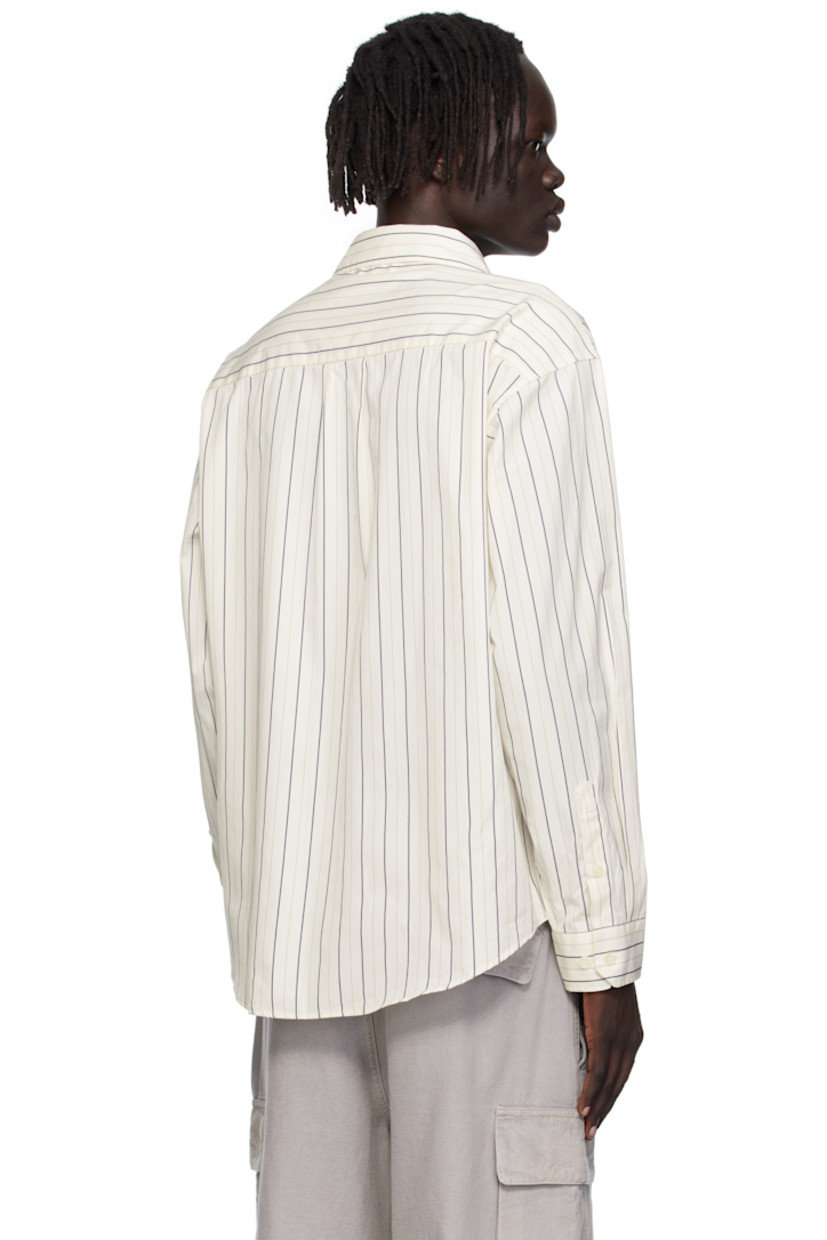 Deadstock cotton poplin shirt.

· Stripes throughout
· Spread collar
· Button closure
· Patch pocket at chest
· Shirttail hem
· Adjustable buttoned barrel cuffs
· Box pleat at back yoke

Available exclusively at SSENSE.

Supplier color: Fine weave stripe