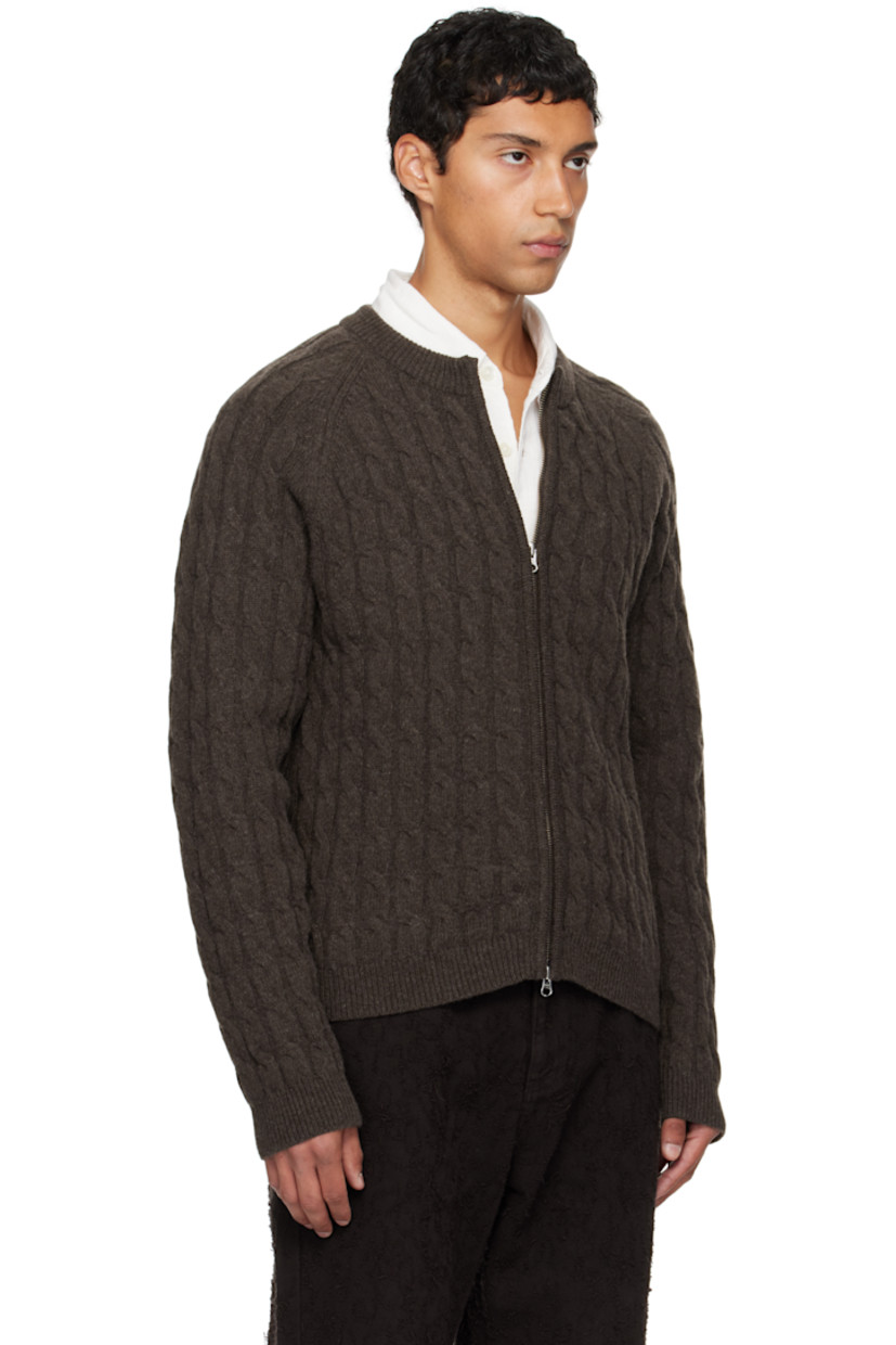 Cable-knit wool sweater.

· Rib-knit crewneck, hem, and cuffs
· Two-way zip closure
· Raglan sleeves

Supplier color: Brown cable knit