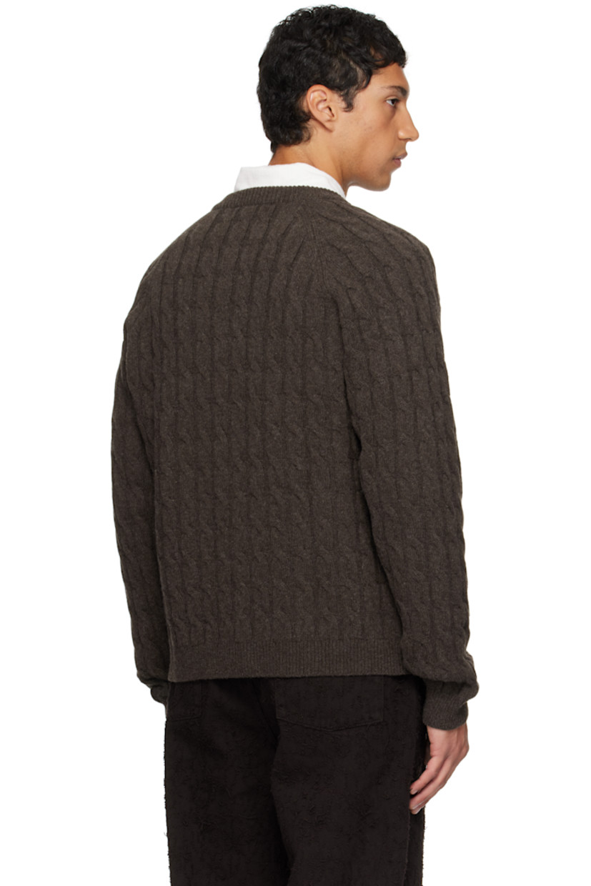 Cable-knit wool sweater.

· Rib-knit crewneck, hem, and cuffs
· Two-way zip closure
· Raglan sleeves

Supplier color: Brown cable knit