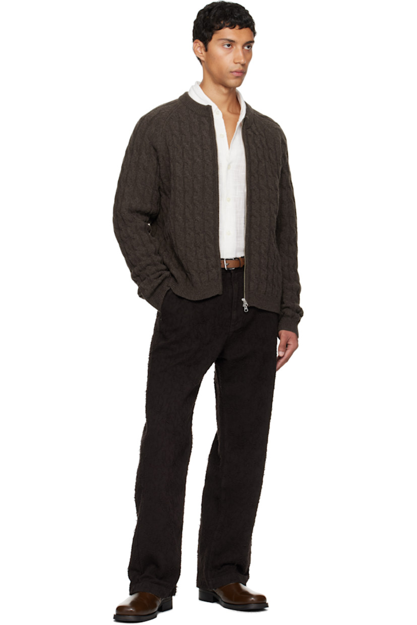 Cable-knit wool sweater.

· Rib-knit crewneck, hem, and cuffs
· Two-way zip closure
· Raglan sleeves

Supplier color: Brown cable knit