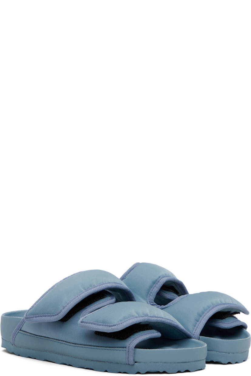 Padded nylon twill flat sandals.

· Grosgrain trim throughout 
· Velcro straps at vamp
· Covered and molded cork footbed
· Treaded rubber sole 

Supplier color: Faded denim