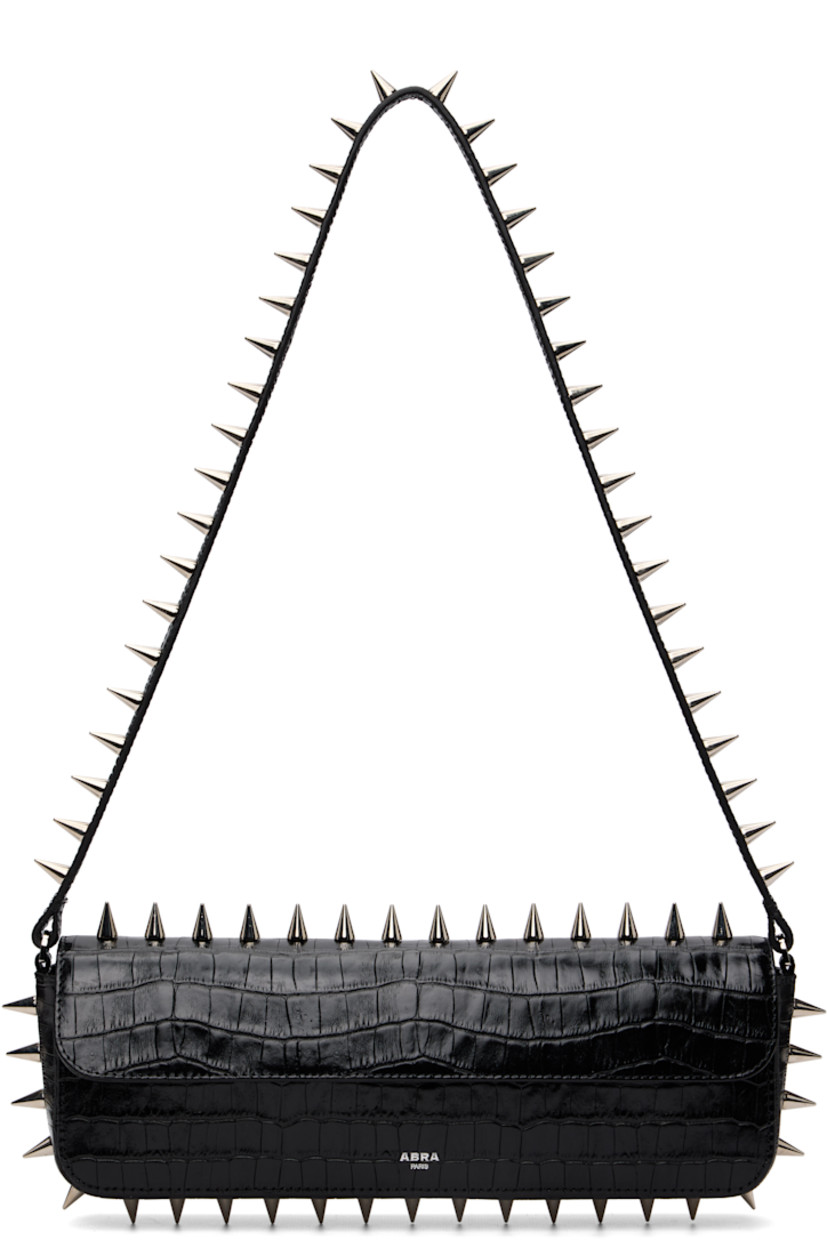 Structured croc-embossed leather shoulder bag.

· Studs throughout
· Fixed shoulder strap
· Silver-tone logo stamp at face
· Magnetic flap
· Patch pocket and D-ring at interior
· Silver-tone hardware
· H4" x W11.75" x D2"

Supplier color: Black crocco
