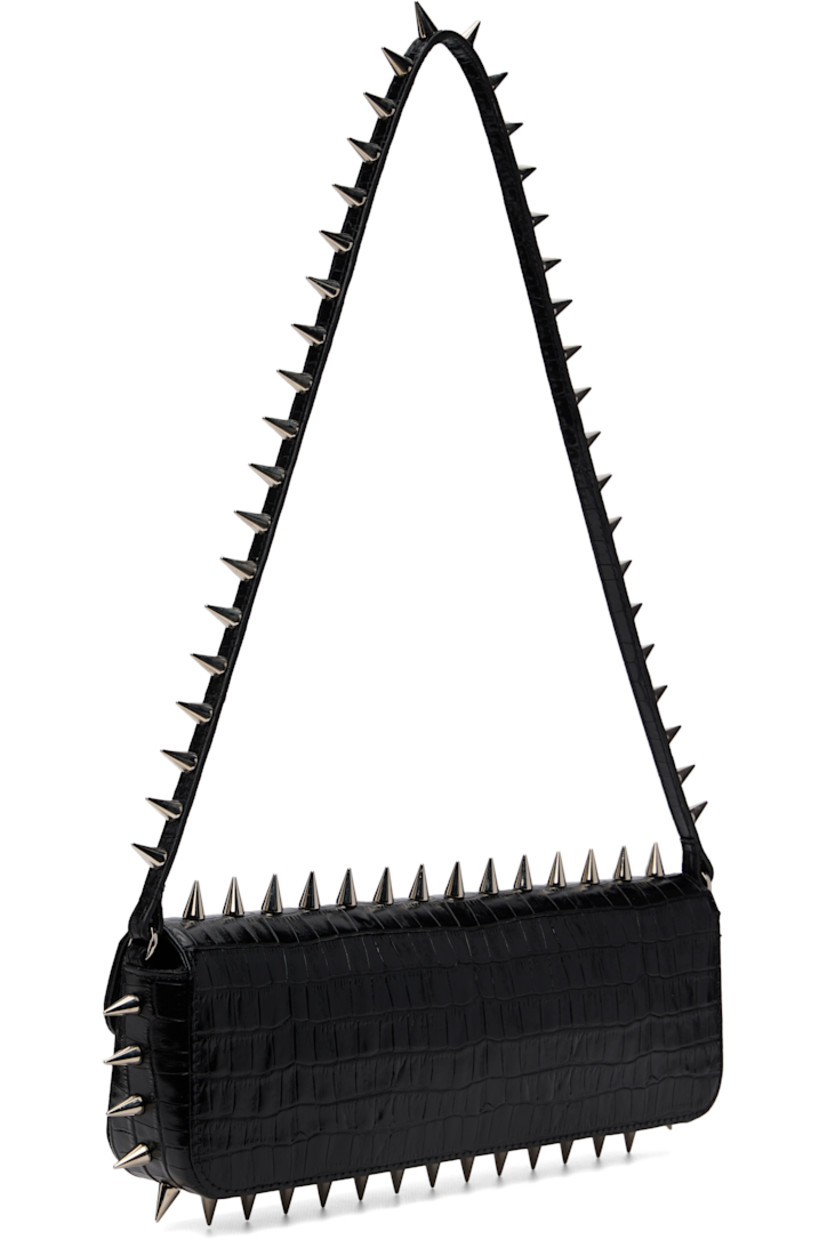 Structured croc-embossed leather messenger bag.

· Studs throughout
· Fixed shoulder strap
· Silver-tone logo stamp at face
· Magnetic flap
· Patch pocket and D-ring at interior
· Silver-tone hardware
· H4" x W11.75" x D2"

Supplier color: Black crocco