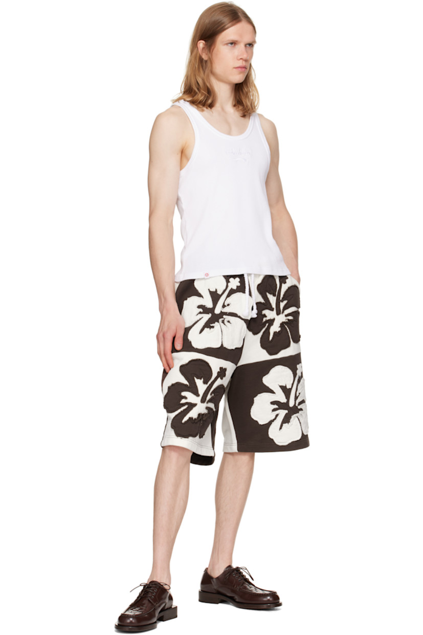 Loose-fit French terry shorts. Floral appliqués throughout.

· Drawstring at elasticized waistband
· Three-pocket styling

Supplier color: Brown