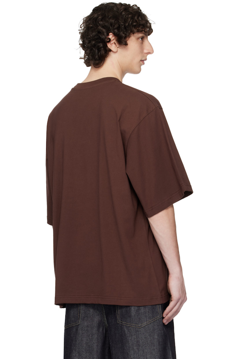 Cotton jersey T-shirt.

· Rib-knit crewneck
· Logo printed at chest
· Cord trim at front
· Dropped shoulders

Supplier color: Brown