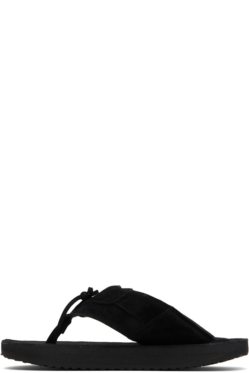 Padded suede flip-flops.

· Open toe
· Thong-style strap and bow accent at vamp
· Logo embossed at padded footbed
· Foam rubber midsole
· Treaded rubber sole

Available exclusively at SSENSE.

Supplier color: Black