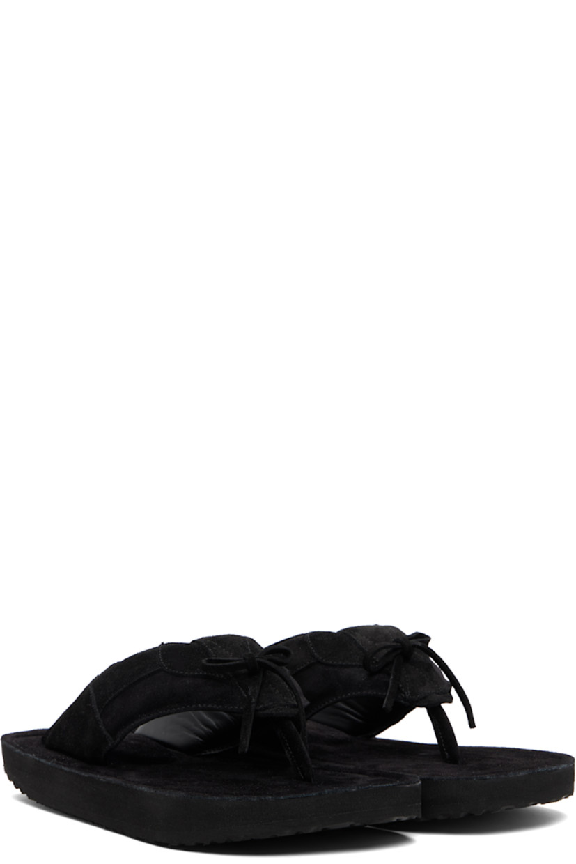 Padded suede flip-flops.

· Open toe
· Thong-style strap and bow accent at vamp
· Logo embossed at padded footbed
· Foam rubber midsole
· Treaded rubber sole

Available exclusively at SSENSE.

Supplier color: Black