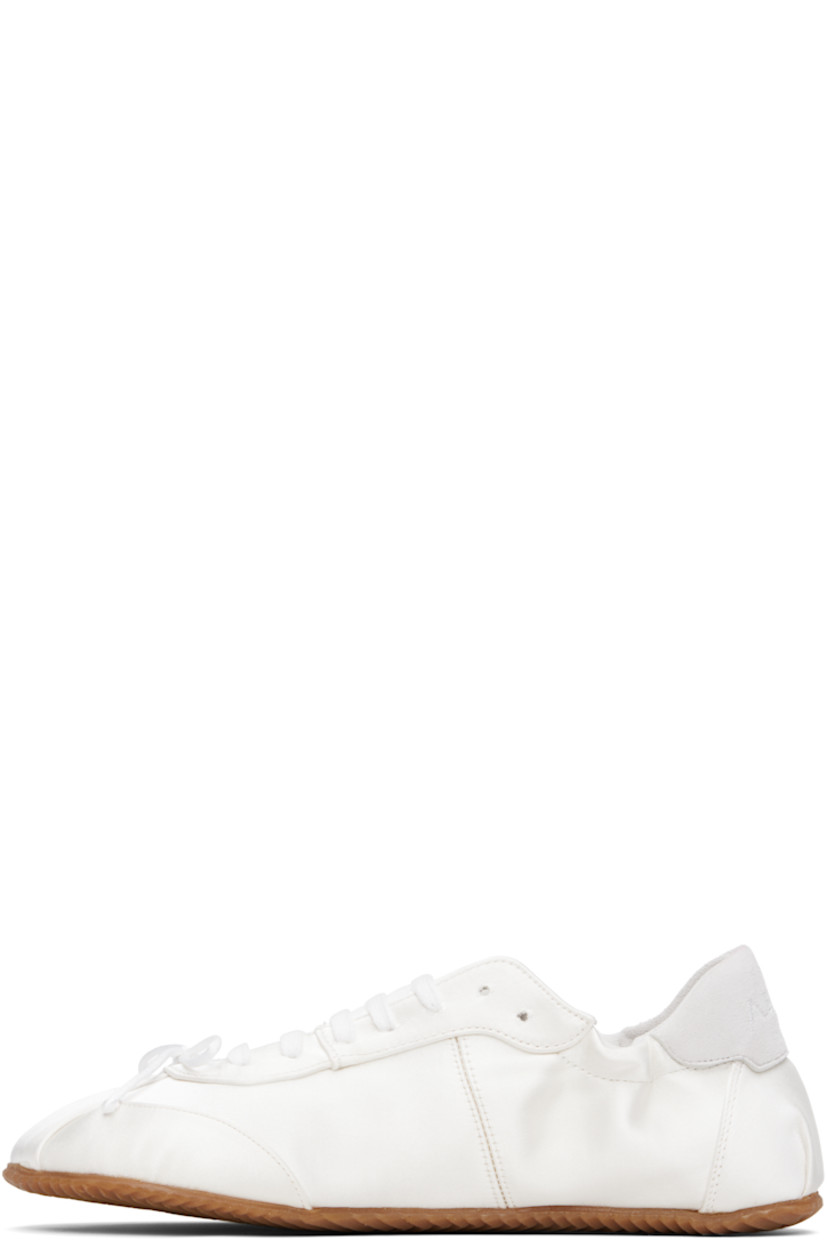 Low-top satin sneakers in white.

· Square toe
· Bow accent at vamp
· Lace-up closure
· Logo embroidered at padded tongue
· Elasticized collar
· Logo embroidered at suede heel tab
· Nubuck and jersey lining
· Treaded rubber sole

Supplier color: White