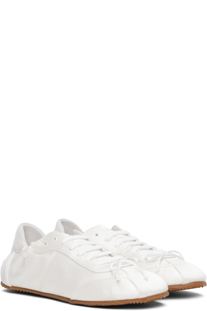 Low-top satin sneakers in white.

· Square toe
· Bow accent at vamp
· Lace-up closure
· Logo embroidered at padded tongue
· Elasticized collar
· Logo embroidered at suede heel tab
· Nubuck and jersey lining
· Treaded rubber sole

Supplier color: White